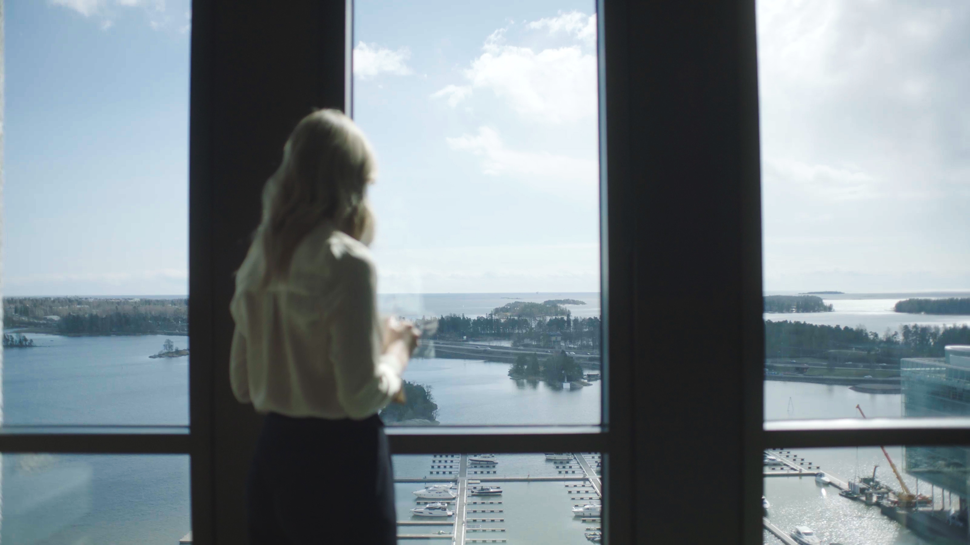 woman looking out of the window
